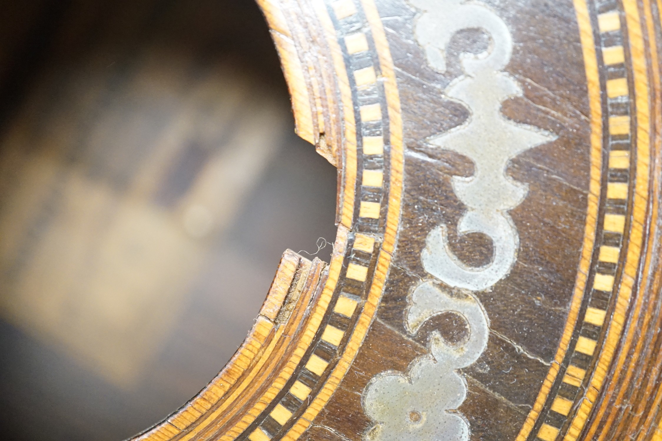 A 19th century Spanish parlour guitar labelled Antonio Carlos Garcia, Madrid. The back 46.5cm excluding button. Lacking strings, with soft case